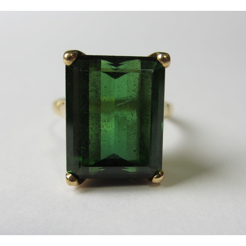 72 - An eighteen carat gold step cut green tourmaline single stone ring