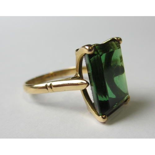 72 - An eighteen carat gold step cut green tourmaline single stone ring