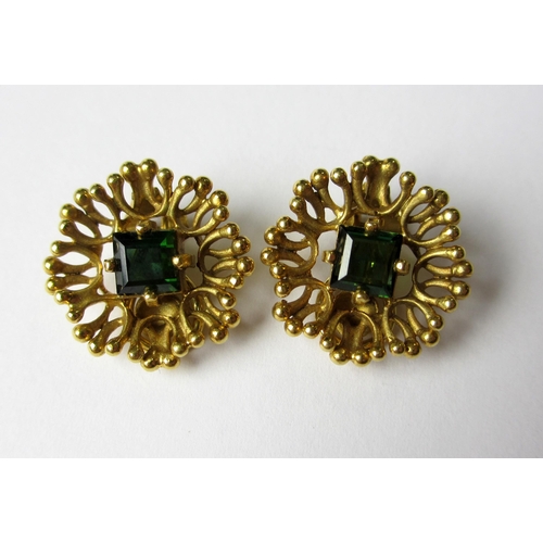 75 - A pair of eighteen carat gold green tourmaline set clip on earrings