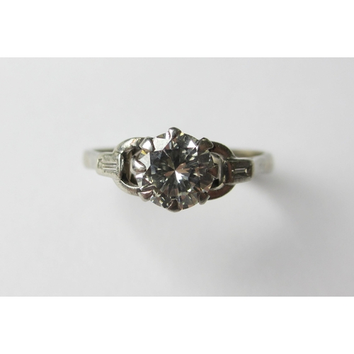 76 - A platinum diamond solitaire ring