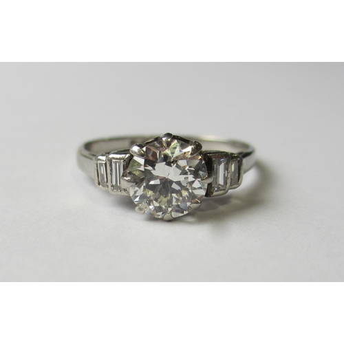 77 - A platinum diamond set dress ring