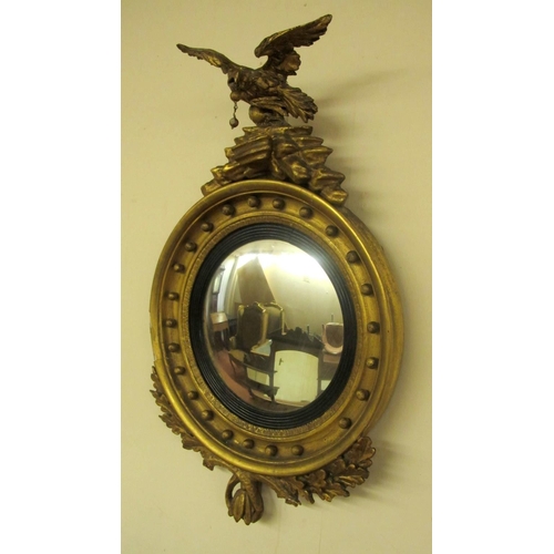 809 - A Regency gilt wood convex wall mirror