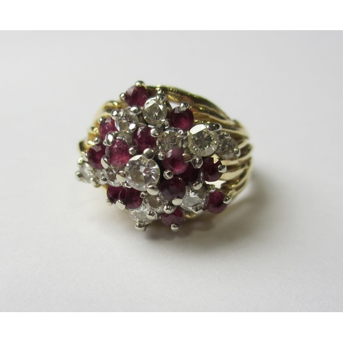 81 - A 14 ct gold ruby and diamond cocktail cluster ring