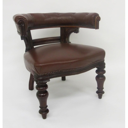 814 - A Victorian leather button back captains armchair