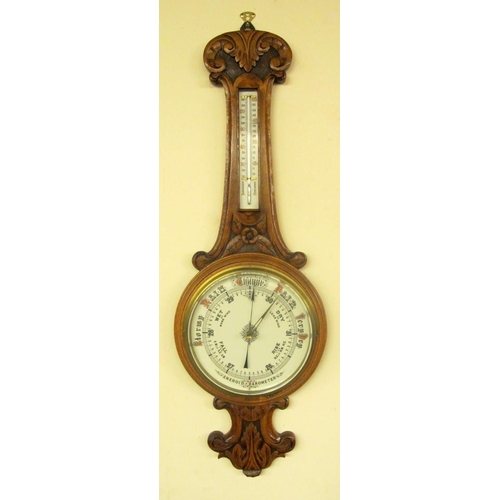 823 - A Victorian oak banjo aneroid wall barometer