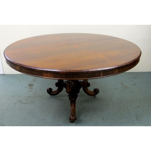 832 - A Victorian rosewood breakfast table