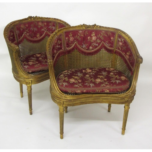 837 - A pair of Louis XV style giltwood bergere side chairs