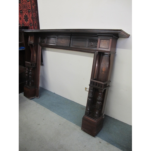 850 - A late Victorian mahogany inlaid fire surround