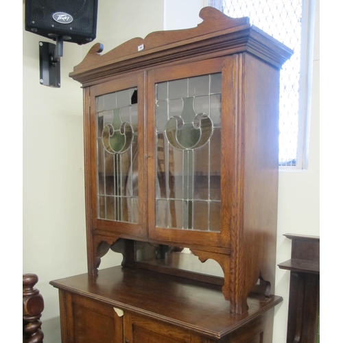 858 - An Art Nouveau bookcase on cupboard chest