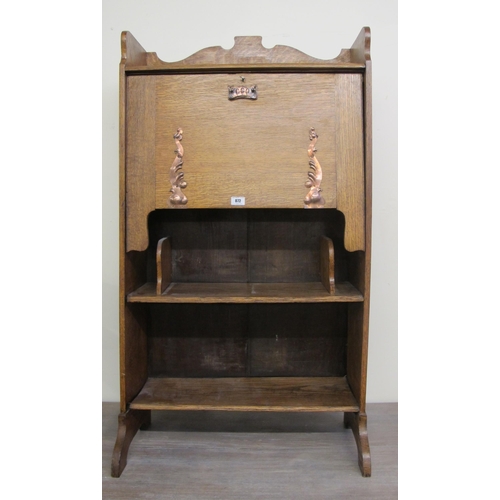 872 - An Arts and Crafts oak secretaire bookcase  decorated with copper stylised appliques 115cm high x 64... 