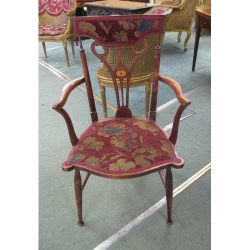 873 - An Art Nouveau mahogany parlour armchair decorated with satinwood inlay and a floral upholstered sea... 