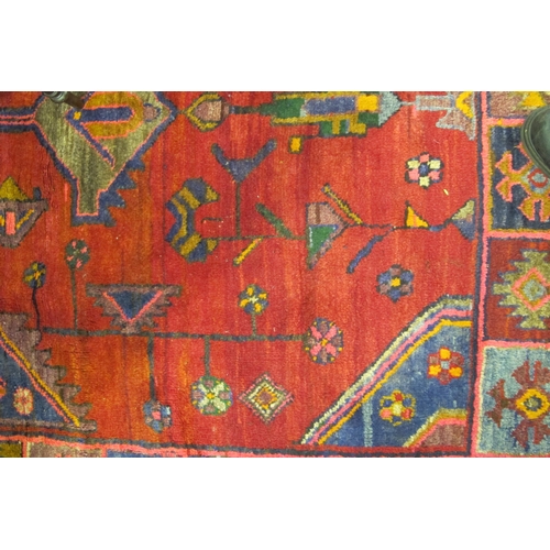 874 - An Iranian 'Nomadic Tribal Lori' rug with geometric design 307cm long x 152cm wide