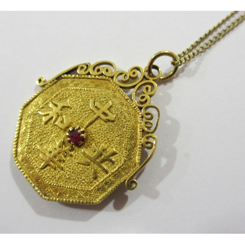 112 - A Chinese high carat gold octagonal coin pendant