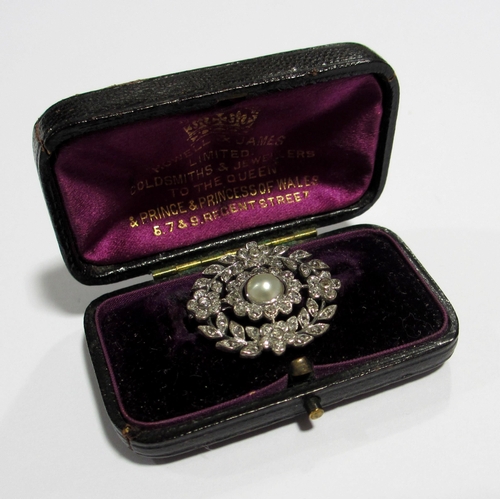 115 - A pretty late 19th century diamond and pearl brooch