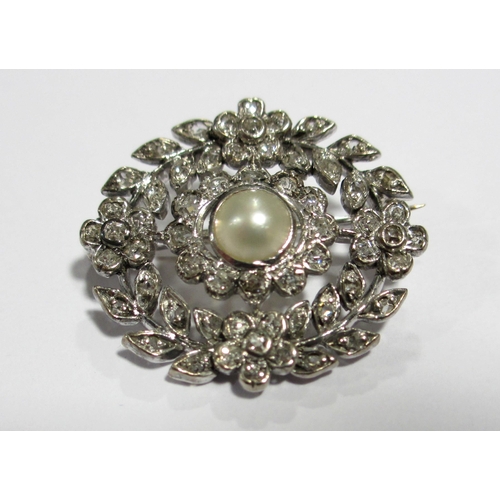 115 - A pretty late 19th century diamond and pearl brooch