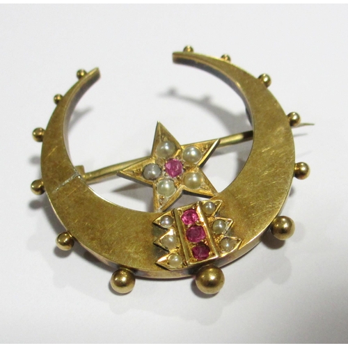 117 - A Victorian 15ct gold ruby and pearl star and crescent brooch