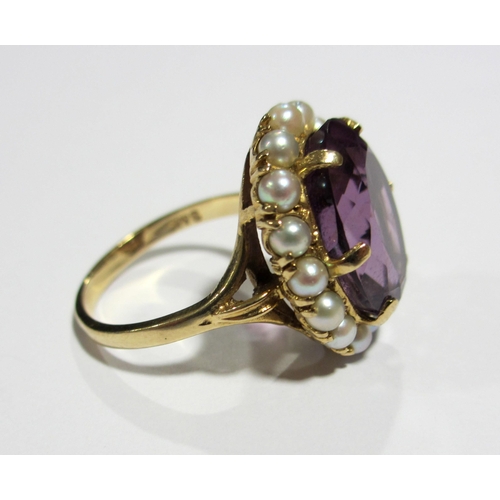 119 - An attractive amethyst and pearl dress ring