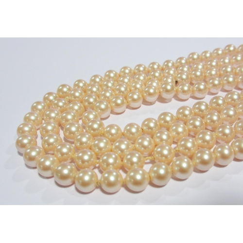 121 - Two strands of cultured pearls