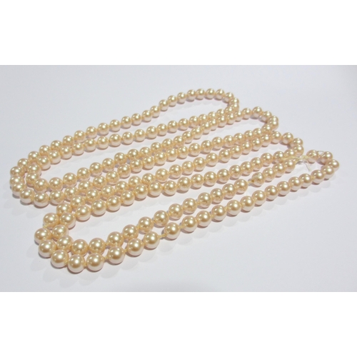 121 - Two strands of cultured pearls