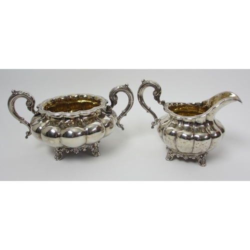 140 - A composite three piece silver tea service