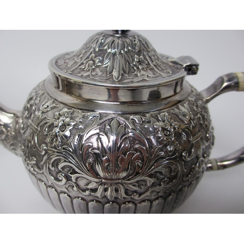 145 - A matched four piece silver tea service