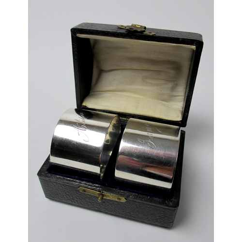 161 - A cased pair of silver napkin rings