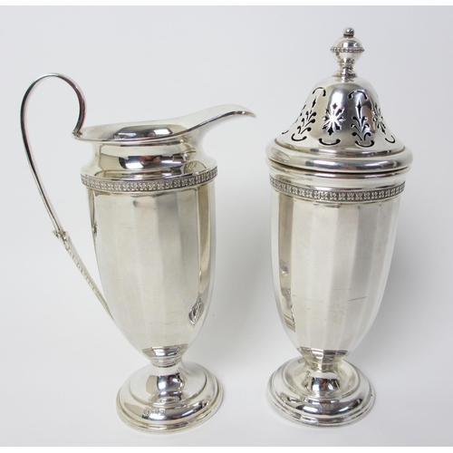 167 - A silver cream jug and sugar castor in the Georgian style