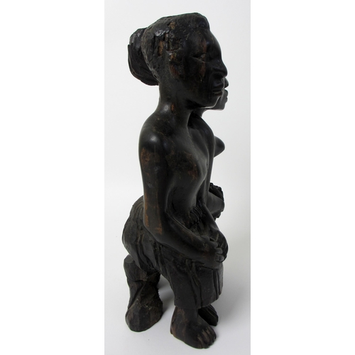 228 - A West African ebony carving of the twins