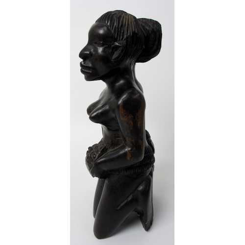 228 - A West African ebony carving of the twins