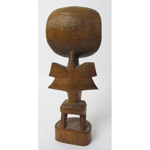 229 - A East African wood carving of a bird like figure