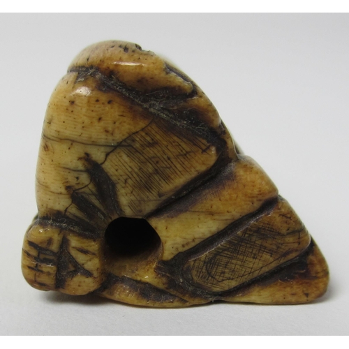 248 - An ivory netsuke carved as a seated sage