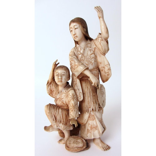 252 - A Japanese ivory group of a mother and child