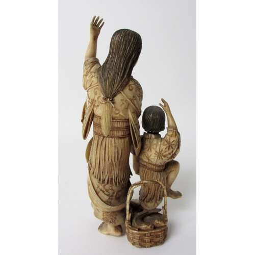 252 - A Japanese ivory group of a mother and child