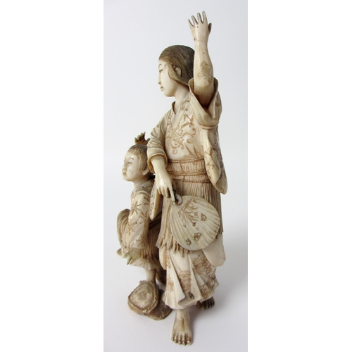 252 - A Japanese ivory group of a mother and child