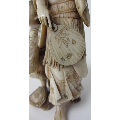 252 - A Japanese ivory group of a mother and child