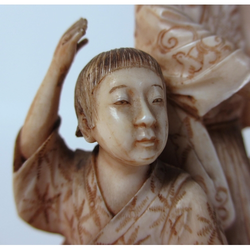 252 - A Japanese ivory group of a mother and child