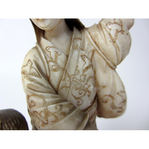 252 - A Japanese ivory group of a mother and child