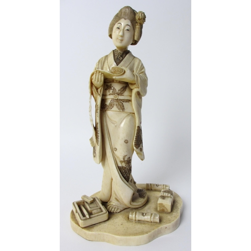 254 - A Japanese carved ivory figure of a scholar