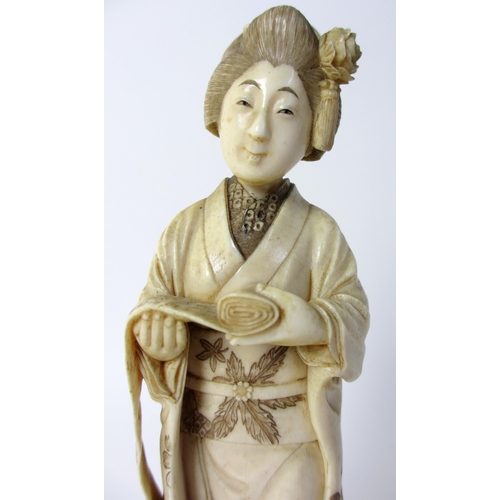 254 - A Japanese carved ivory figure of a scholar