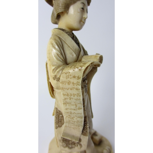 254 - A Japanese carved ivory figure of a scholar