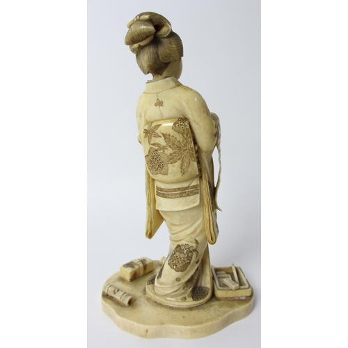 254 - A Japanese carved ivory figure of a scholar