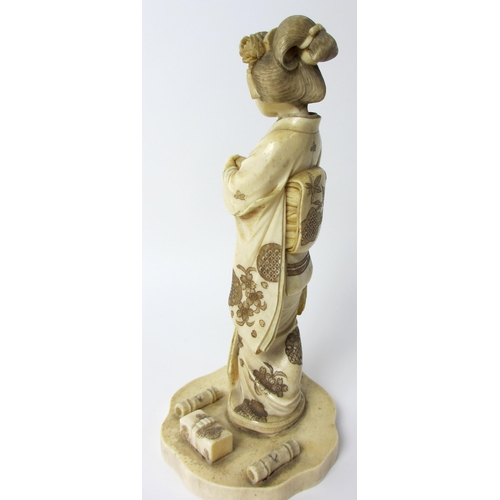 254 - A Japanese carved ivory figure of a scholar