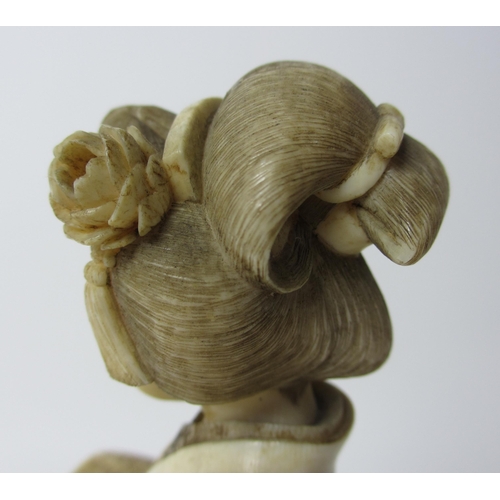 254 - A Japanese carved ivory figure of a scholar