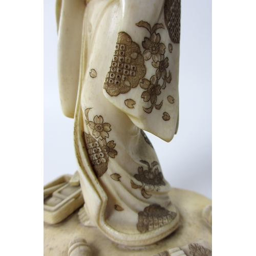 254 - A Japanese carved ivory figure of a scholar