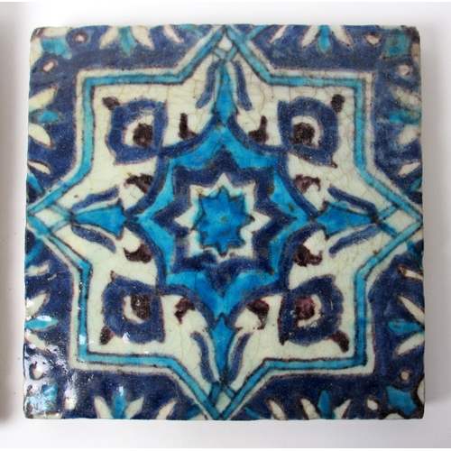 262 - Two Persian blue and white moulded tiles