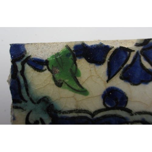 262 - Two Persian blue and white moulded tiles