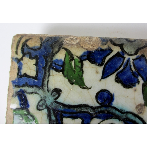 262 - Two Persian blue and white moulded tiles