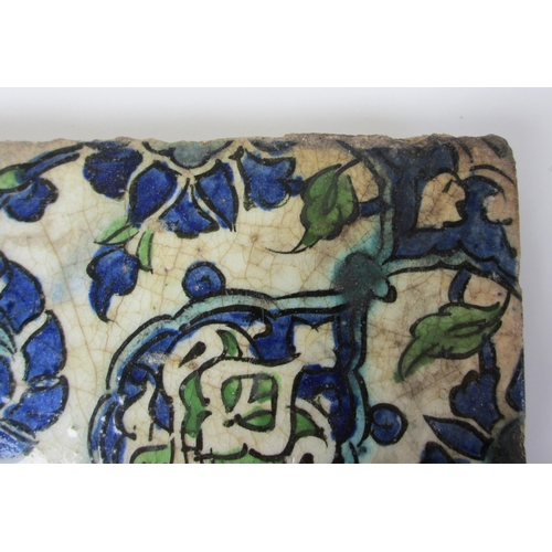 262 - Two Persian blue and white moulded tiles