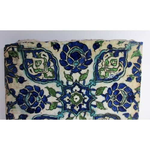 262 - Two Persian blue and white moulded tiles