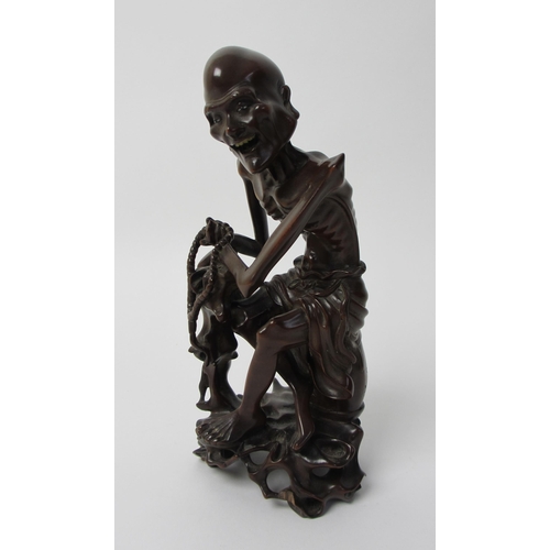 268 - A Chinese carved wood figure of a Senin